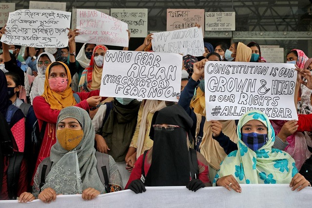muslim students display placards during a protest against the recent hijab ban in few colleges of karnataka state at aliah university in kolkata india february 9 2022 photo reuters