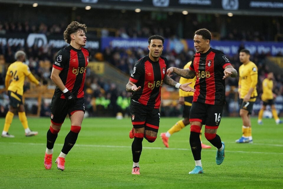 bournemouth s justin kluivert celebrates scoring their third goal with milos kerkez and marcus tavernier during premier league match between wolverhampton wanderers and afc bournemouth at molineux stadium wolverhampton britain on november 30 2024 photo reuters