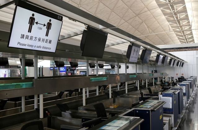 social distancing signs are seen at the hong kong international airport following the coronavirus outbreak in hong kong china may 7 2020 picture taken may 7 2020 photo reuters