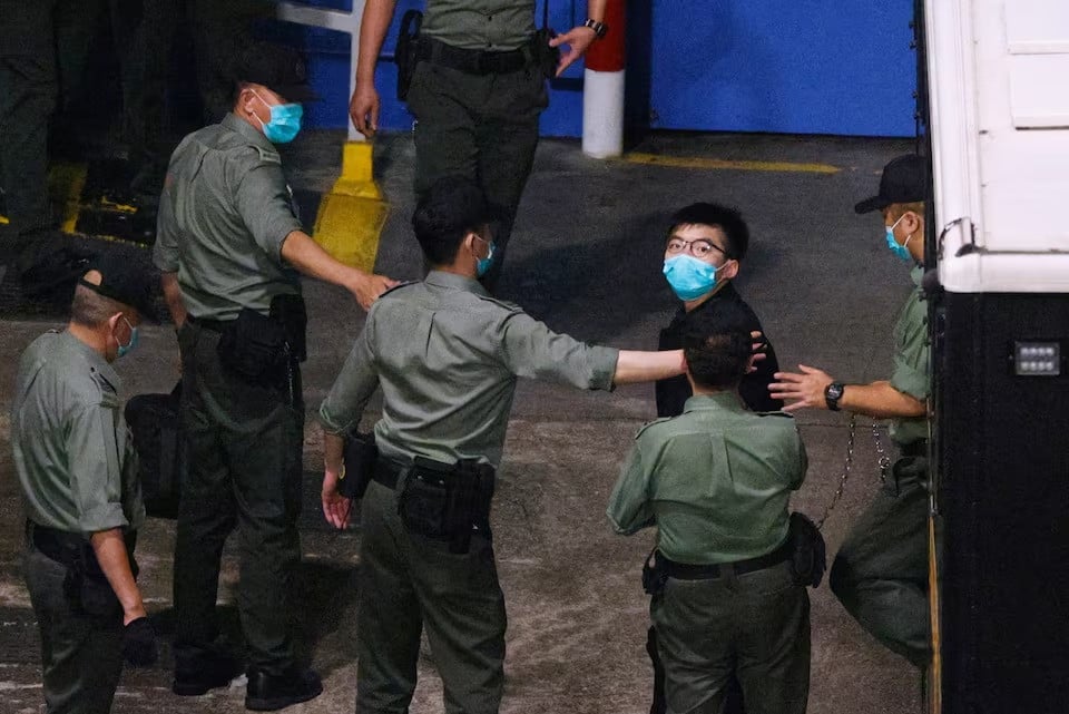 pro democracy activist joshua wong looks on upon arriving at lai chi kok reception centre after he remained in custody over the national security law charge in the early morning in hong kong china mcedarch 2 2021 reuters tyr