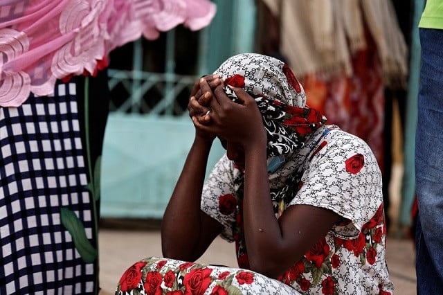 kaba a mother of a ten day old baby reacts as she sits outside the hospital where newborn babies died in a fire at the neonatal section of a regional hospital in tivaouane senegal may 26 2022 photo reuters