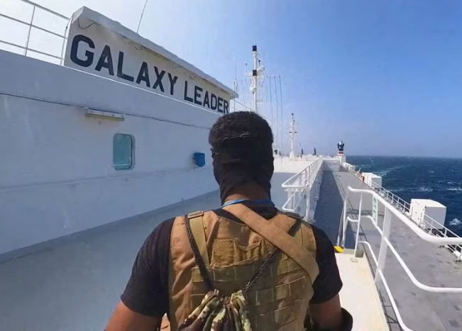 a houthi fighter stands on the galaxy leader cargo ship in the red sea in this photo released november 20 2023