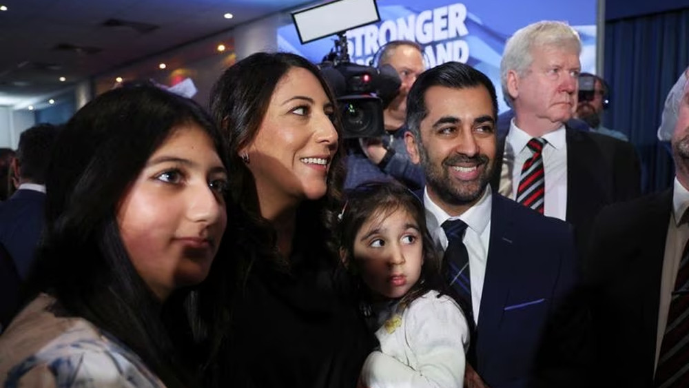 humza yousaf poses for a picture with his family in edinburgh after being announced as the new scottish national party leader on march 27 2023 reuters photo