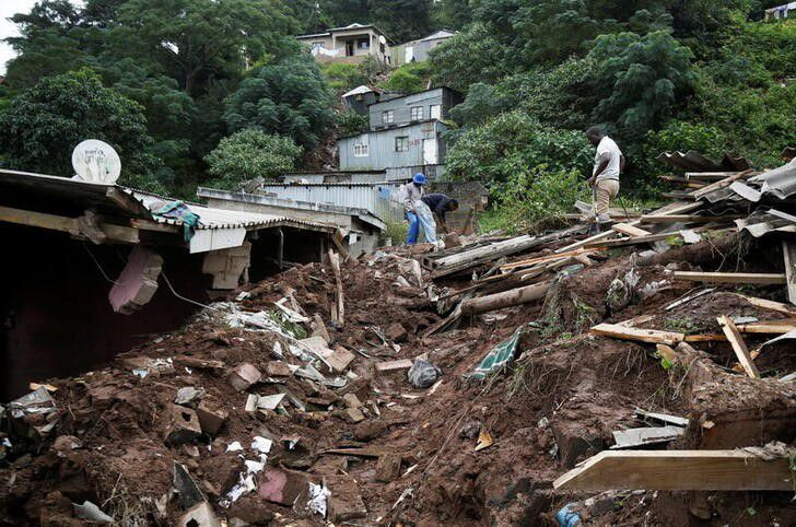 men sift through the rubble of a church which collapsed onto a house killing four children in clermont durban south africa april 13 2022 photo reuters