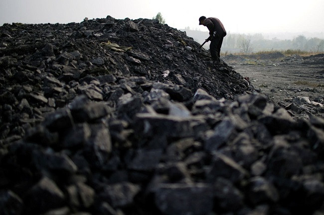 zhang tieliang 76 sifts through dunes of low grade coal near a coal mine in ruzhou henan province china november 4 2021 photo reuters