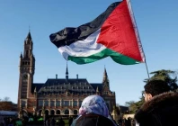 protesters hold a palestinian flag as they gather outside the international court of justice icj in the hague netherlands january 26 2024 photo reuters