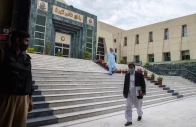 a lawyer walks past in front of the peshawar high court building photo afp