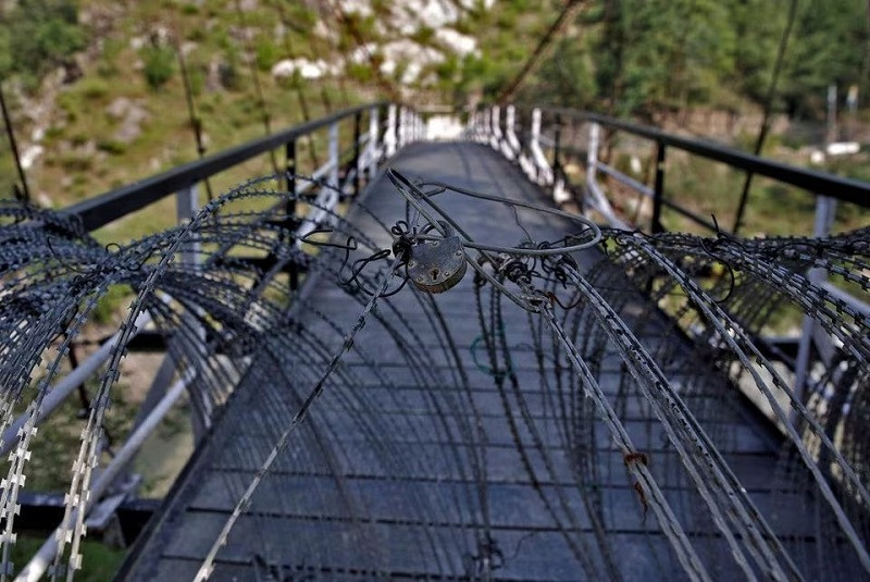 a padlock on concertina wires on a footbridge connecting iiojk and ajk in teetwal in iiojk s kupwara district august 9 2022 photo reuters