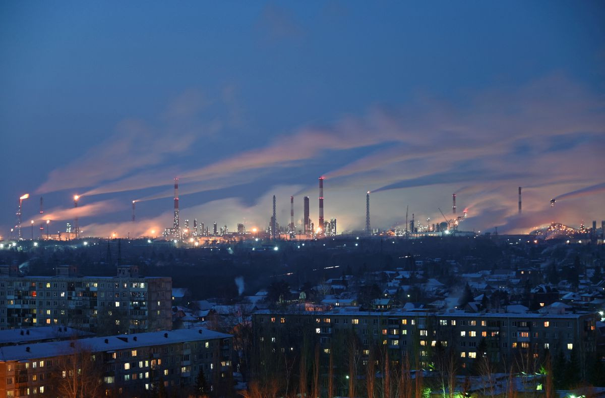 a general view shows a local oil refinery behind residential buildings in omsk russia february 10 2021 photo reuters