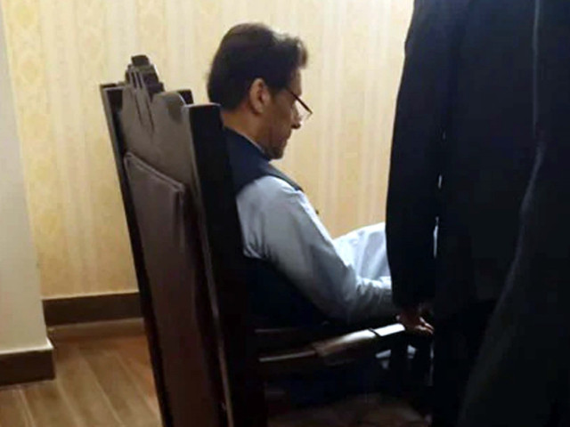 pti chairman imran khan sits in a chair in the nab court in islamabad photo ppi