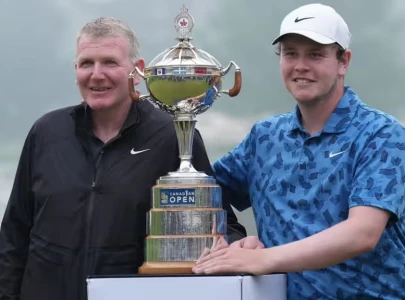 macintyre with dad as caddie gets tearful canadian open win
