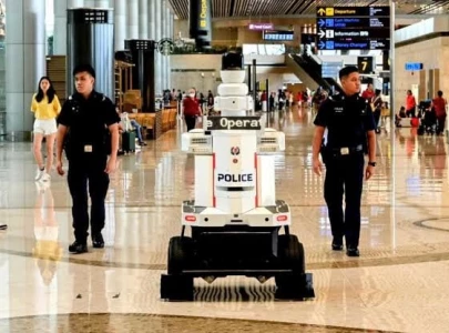police robots now patrol at singapore airport