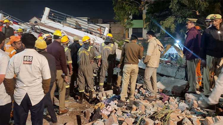 twelve rescued after building collapses in india more feared trapped photo reuters