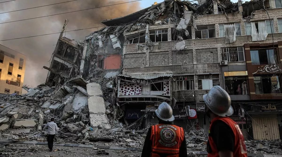safety officials inspect damaged buildings in gaza city following an israeli airstrike on may 12 2021 photo the indian express safety officials inspect damaged buildings in gaza city following an israeli airstrike on may 12 2021 photo the indian express