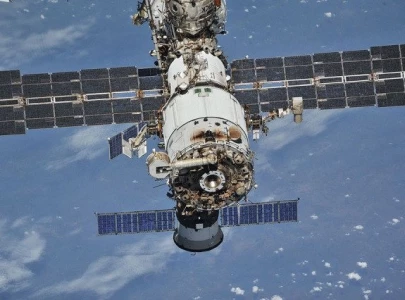 international space station fires thrusters to avoid satellite collision