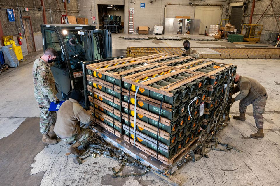 airmen and civilians from the 436th aerial port squadron palletize ammunition weapons and other equipment bound for ukraine during a foreign military sales mission at dover air force base in delaware us january 21 2022 us air force mauricio campino handout via reuters