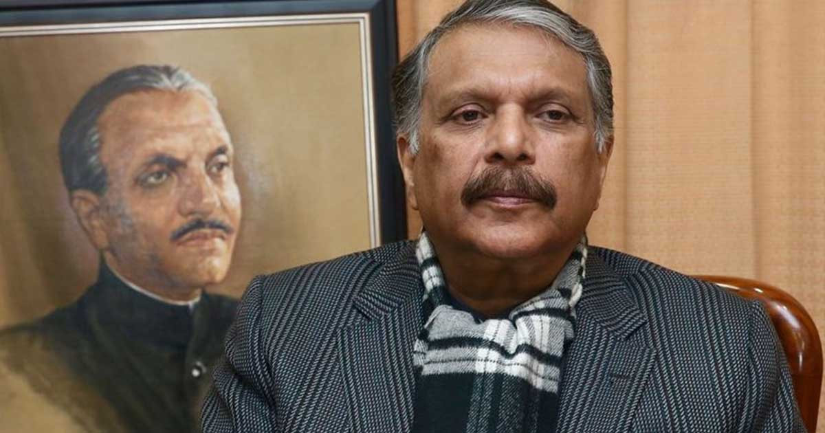 ijazul haq chief of the pakistan muslim league zia pml z posing in front of a picture of his late father former president and army chief general retired ziaul haq file photo