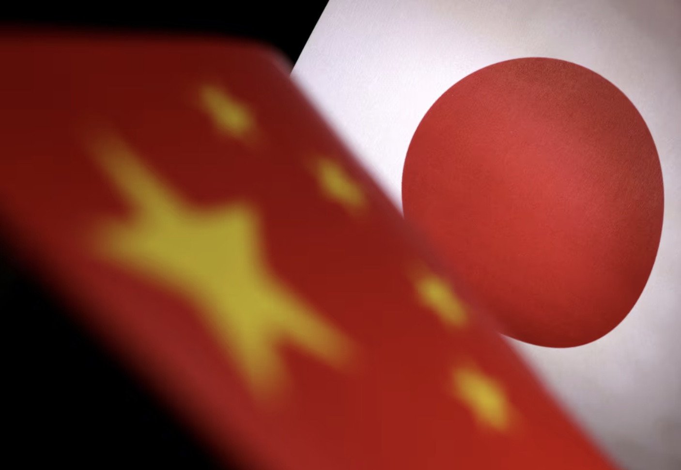 printed chinese and japanese flags are seen in this illustration photo reuters