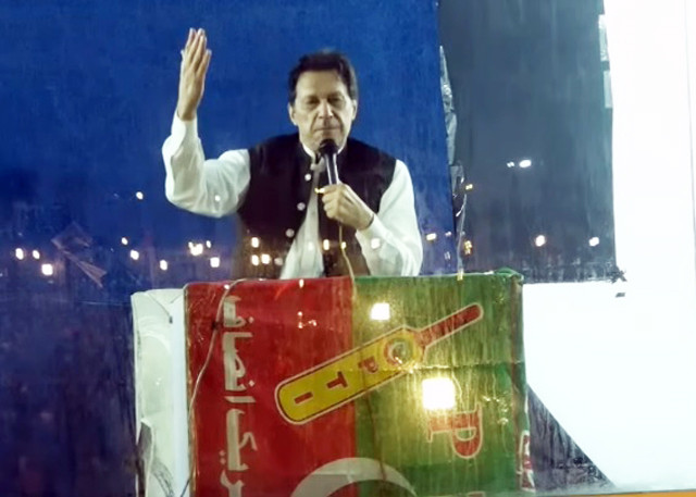 pti chief imran khan is addressing his supporters from inside his bullet proof cabin during his party s rally at minar e pakistan in lahore on march 25 26 2023 screengrab
