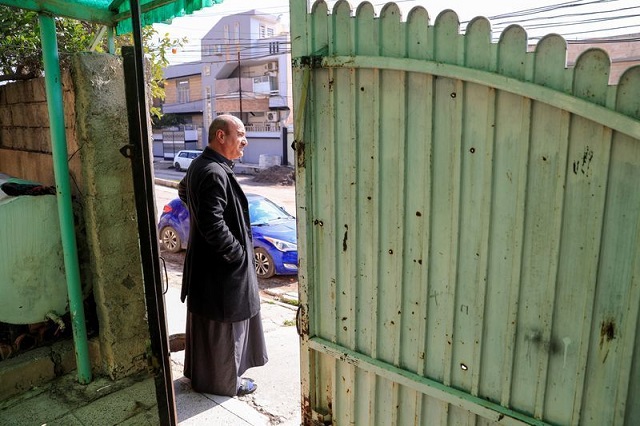 thanoun yahya an iraqi christian is seen near his home which he reclaimed when islamic state militants was driven out in mosul iraq february 21 2021 picture taken february 21 2021 photo reuters