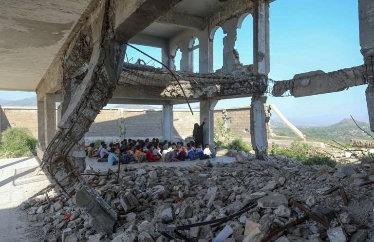 yemeni pupils attend class on the first day of the new academic year in the city of taez in their ruined school hit in a 2016 air strike photo afp