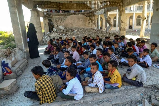 The makeshift classroom is basic, but many Yemeni children don't get to go to school at all -- two million of the war-ravaged country's seven million school-age children do not attend. PHOTO: AFP