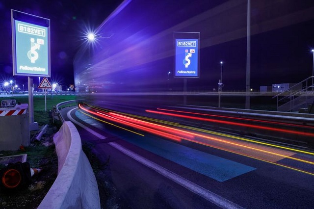 a truck drives over green and orange lines on the road that are part of the new customs infrastructure for entry into france in calais france january 1 2021 photo reuters