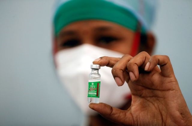a nurse displays a vial of covishield the astrazeneca covid 19 vaccine manufactured by serum institute of india at a medical centre in mumbai india january 16 2021 photo reuters