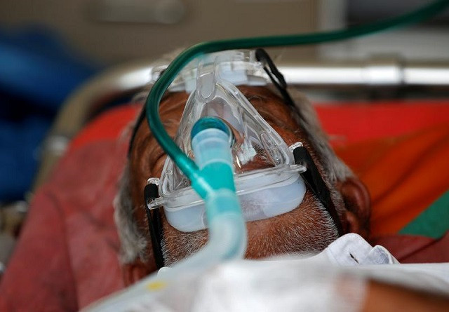 a patient wearing an oxygen mask is seen inside an ambulance waiting to enter a covid 19 hospital for treatment amidst the spread of the coronavirus disease covid 19 in ahmedabad india april 25 2021 photo reuters