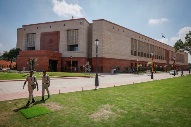 police officers walk in front of india s new parliament building a day before its inauguration in new delhi india september 18 2023 photo reuters police officers walk in front of india s new parliament building a day before its inauguration in new delhi india september 18 2023 photo reuters