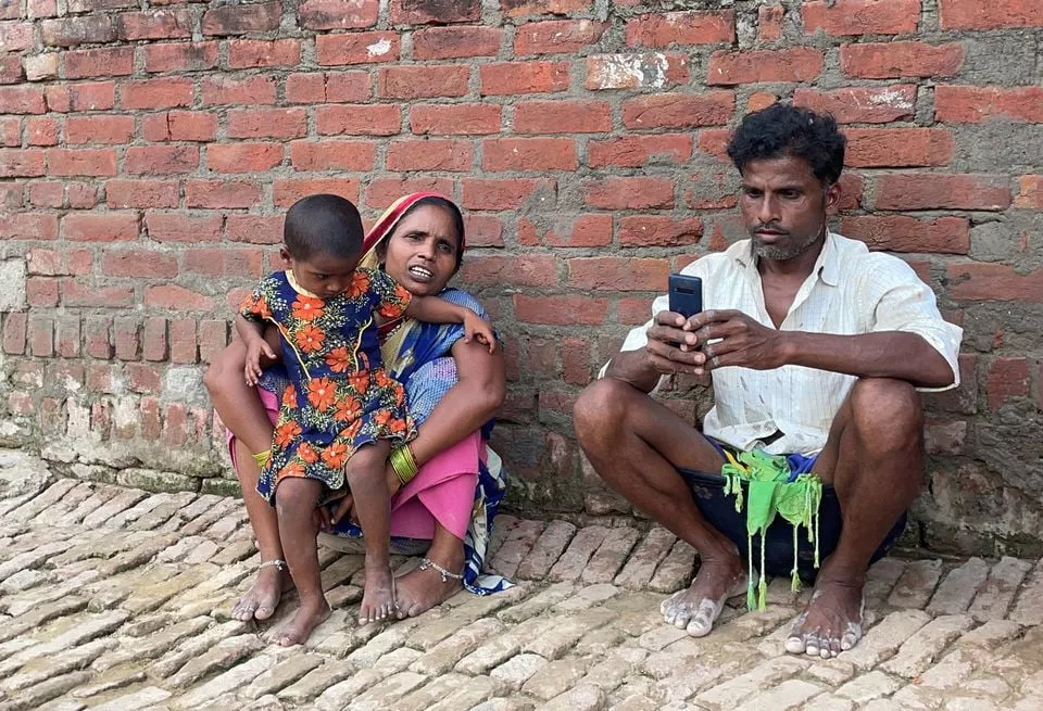asha devi 35 a mother of five who is a labour worker sits along with her husband and their daughter outside her one room house in dihwa village in the northern state of uttar pradesh india june 22 2021 picture taken june 22 2021 reuters aftab ahmed asha devi 35 a mother of five who is a labour worker sits along with her husband and their daughter outside her one room house in dihwa village in the northern state of uttar pradesh india june 22 2021 picture taken june 22 2021 reuters aftab ahmed