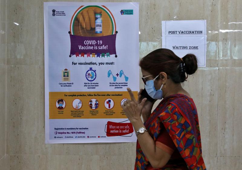 a woman speaks inside a waiting zone area at a health clinic where covid 19 vaccination is being given to healthcare workers in kolkata india february 1 2021 photo reuters file