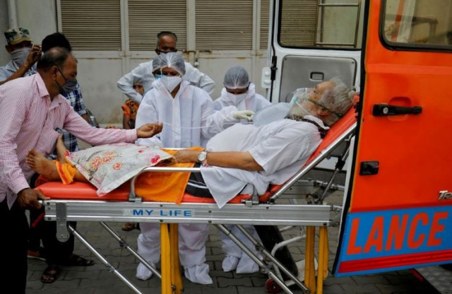 a patient wearing an oxygen mask is wheeled inside a covid 19 hospital for treatment amidst the spread of the coronavirus disease covid 19 in ahmedabad india april 26 2021 reuters amit dave a patient wearing an oxygen mask is wheeled inside a covid 19 hospital for treatment amidst the spread of the coronavirus disease covid 19 in ahmedabad india april 26 2021 reuters amit dave