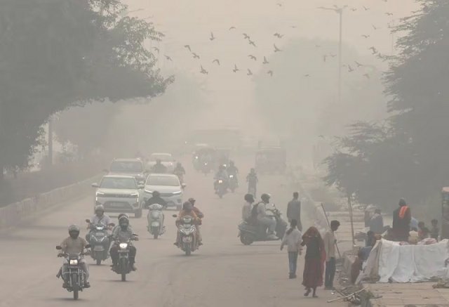 people and vehicles are seen on a road amidst the morning smog in new delhi india november 8 2023 photo reuters people and vehicles are seen on a road amidst the morning smog in new delhi india november 8 2023 photo reuters