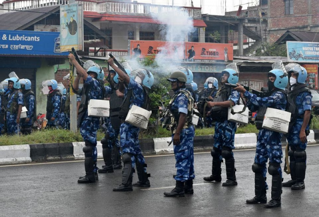 riot police officers fire tear smoke shells to disperse demonstrators in imphal manipur india september 18 2023 photo reuters riot police officers fire tear smoke shells to disperse demonstrators in imphal manipur india september 18 2023 photo reuters