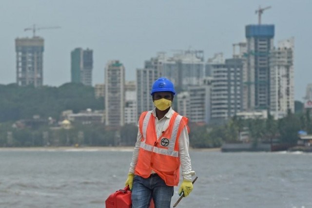 some workers have returned to mumbai but more than 10 000 building sites are lying virtually abandoned due to severe labour shortages across the city photo afp