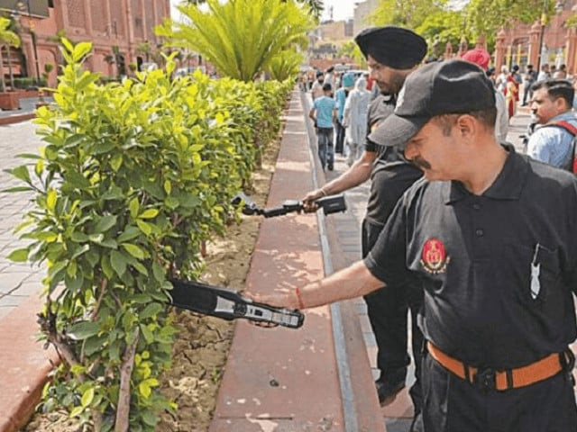 bomb disposal squad inspect the area around the temple after a blast on monday photo afp bomb disposal squad inspect the area around the temple after a blast on monday photo afp