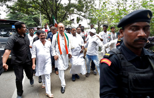 india s main opposition congress party s leaders k c venugopal 2 l ghulam nabi azad c and outgoing chief minister of the southern state of karnataka siddaramaiah lead a protest against india s ruling bharatiya janata party bjp leader b s yeddyurappa s swearing in as chief minister of the southern state in bengaluru india may 18 2018 photo reuters
