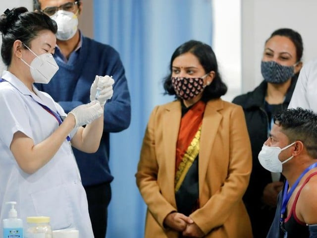 sanitation worker manish kumar who according to the officials is the first person in the country vaccinated against the covid 19 prepares to receive a dose of bharat biotech s covaxin during the coronavirus disease covid 19 vaccination campaign at all india institute of medical sciences aiims hospital in new delhi india january 16 2021 photo reuters sanitation worker manish kumar who according to the officials is the first person in the country vaccinated against the covid 19 prepares to receive a dose of bharat biotech s covaxin during the coronavirus disease covid 19 vaccination campaign at all india institute of medical sciences aiims hospital in new delhi india january 16 2021 photo reuters