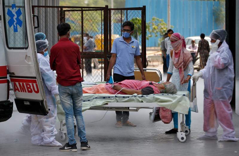 a patient lies in a bed as she is being shifted to a hospital for treatment amidst the spread of the coronavirus disease covid 19 in ahmedabad india april 15 2021 photo reuters