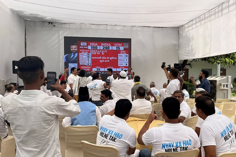 Supporters of India's main opposition Congress party celebrate as a TV report shows their party allies leading in many seats, inside the premises of the party's headquarters in New Delhi, India, June 4, 2024. PHOTO: REUTERS