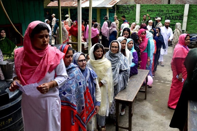 women wait to cast their votes at a polling station during the first phase of the general election in imphal manipur india april 19 2024 photo reuters