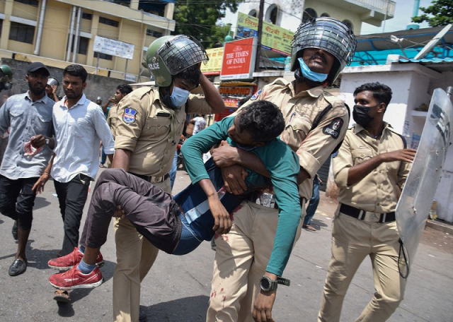 policemen carry an injured protestor during a protest against agnipath scheme for recruiting personnel for armed forces in secunderabad in the southern state of andhra pradesh india june 17 2022 photo reuters policemen carry an injured protestor during a protest against agnipath scheme for recruiting personnel for armed forces in secunderabad in the southern state of andhra pradesh india june 17 2022 photo reuters