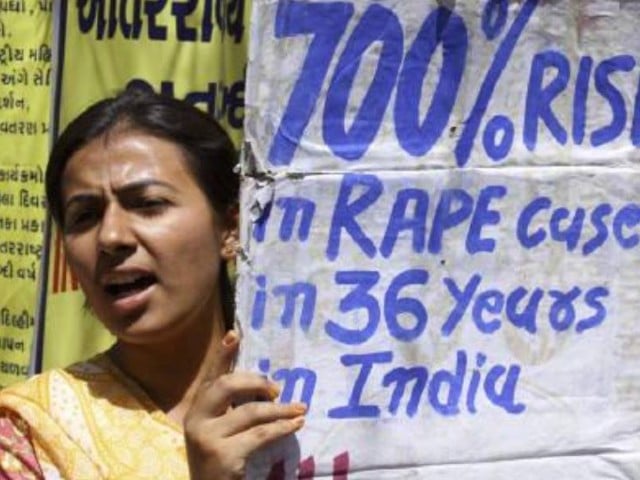 a member of all india mahila sanskritik sanghatan aimss holds a placard during a demonstration against what they say is violence against women in ahmedabad photo reuters file