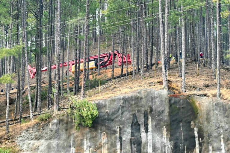 Digging has also begun in the forested hill on a vertical shaft above the trapped men. PHOTO: AFP