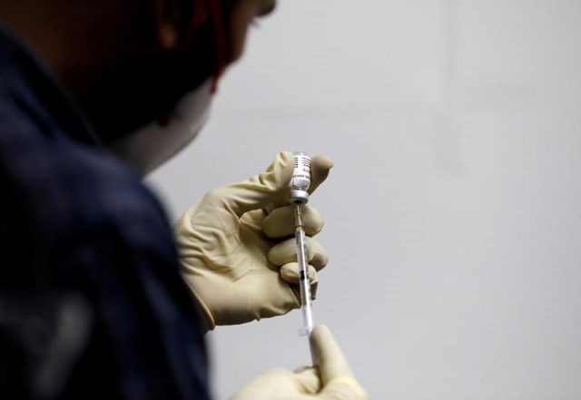file photo a medic fills a syringe with covaxin an indian government backed experimental covid 19 vaccine before administering it to a health worker during its trials at the gujarat medical education and research society in ahmedabad india november 26 2020 reuters amit dave file photo file photo a medic fills a syringe with covaxin an indian government backed experimental covid 19 vaccine before administering it to a health worker during its trials at the gujarat medical education and research society in ahmedabad india november 26 2020 reuters amit dave file photo