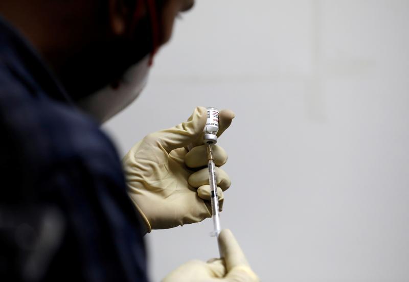 file photo a medic fills a syringe with covaxin an indian government backed experimental covid 19 vaccine before administering it to a health worker during its trials at the gujarat medical education and research society in ahmedabad india november 26 2020 reuters amit dave file photo