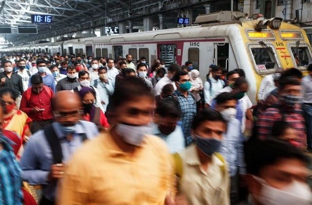 commuters walk on a railway platform after disembarking from a train amidst the spread of the coronavirus disease covid 19 in mumbai india february 9 2021 photo reuters commuters walk on a railway platform after disembarking from a train amidst the spread of the coronavirus disease covid 19 in mumbai india february 9 2021 photo reuters