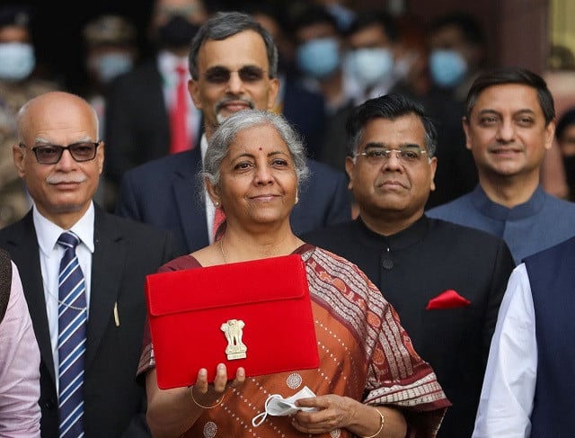 india s finance minister nirmala sitharaman holds up a folder with the government of india s logo as she leaves her office to present the federal budget in the parliament in new delhi india february 1 2022 photo reuters