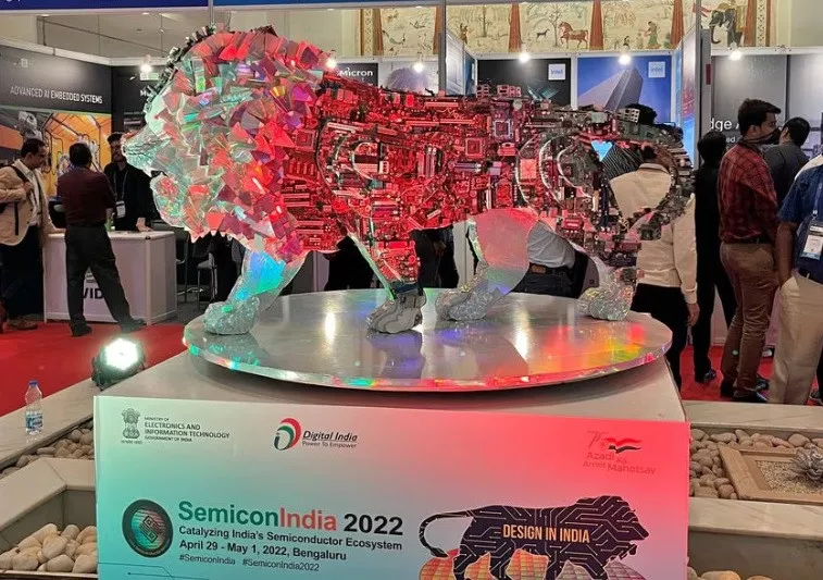 visitors stand next to a make in india logo during a three day semiconductor event in bengaluru india april 30 2022 reuters munsif vengattil file photo visitors stand next to a make in india logo during a three day semiconductor event in bengaluru india april 30 2022 reuters munsif vengattil file photo